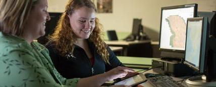 An instructor working with a student.